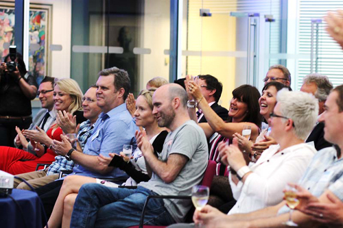 Image of people clapping at Laughology book launch party