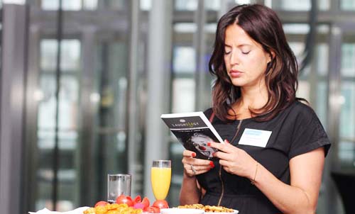 Image of woman reading the laughology book